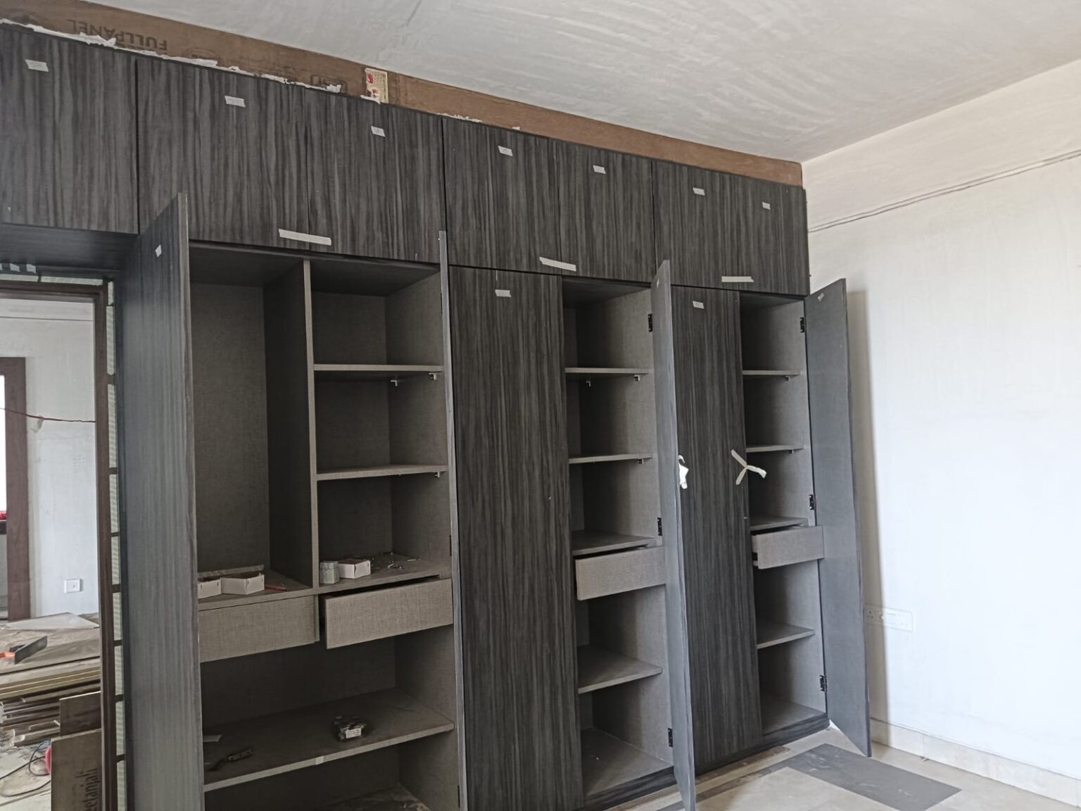 grey-wood-wardrobe-open-drawers-view
