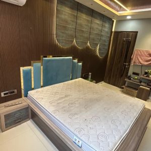 modern-bedroom-blue-headboard-wood-paneling